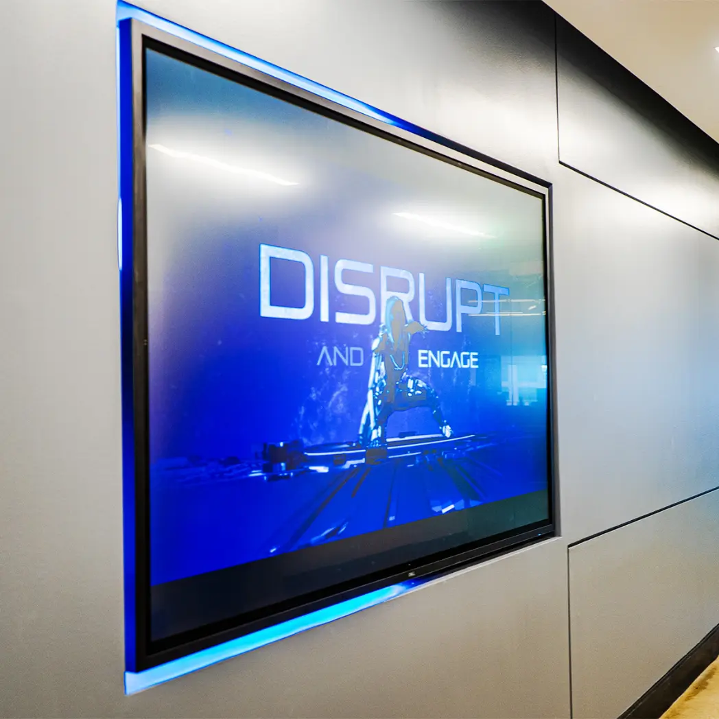 Flush-mount television screen in corporate office environment.