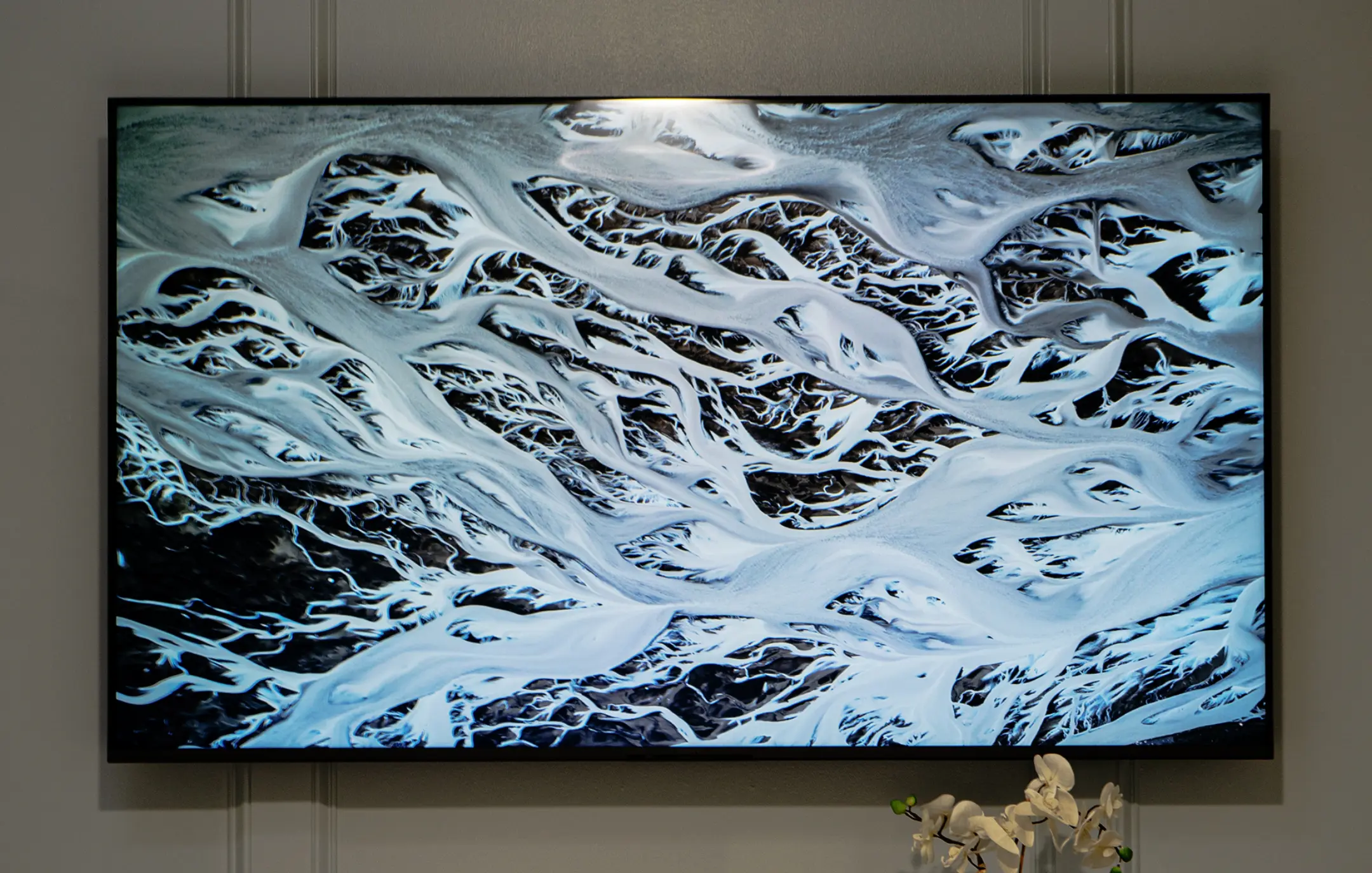 AV install over paneled wall at corporate office.