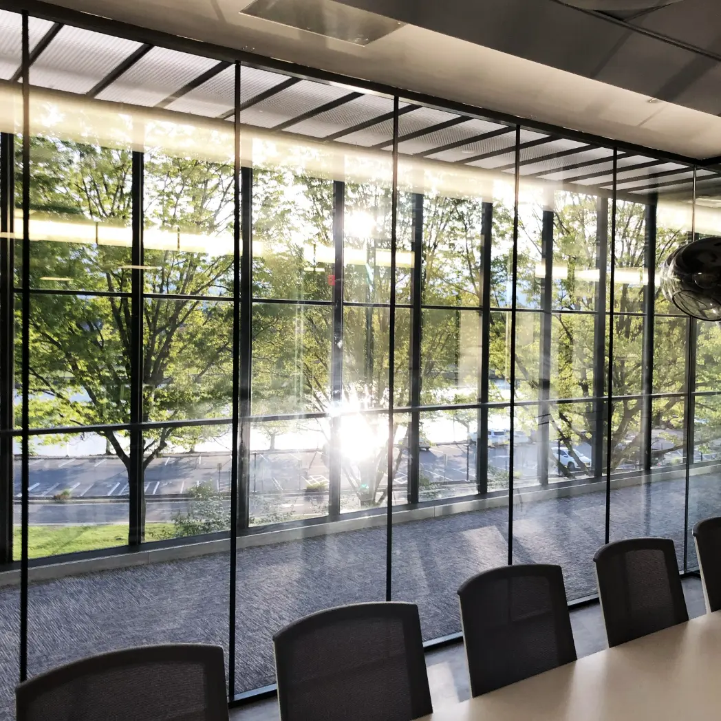 Conference room with floor to ceiling windows.