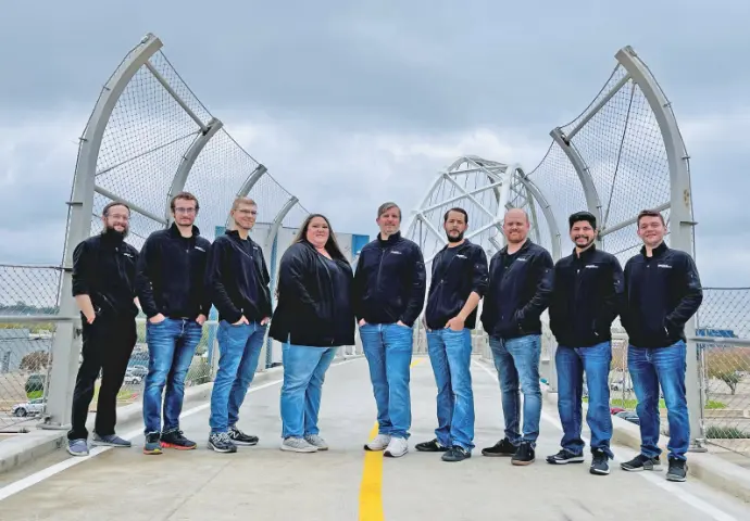  IQueue Media team members on bridge in Downtown Dallas. 