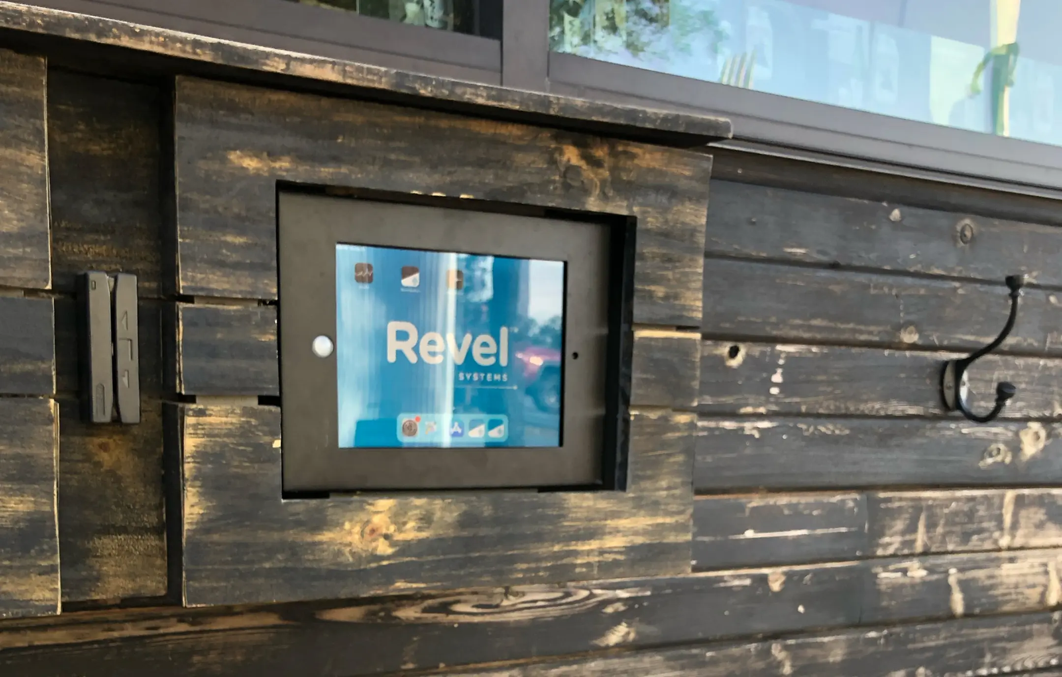 Revel Systems screen installation at restaurant drive-thru.