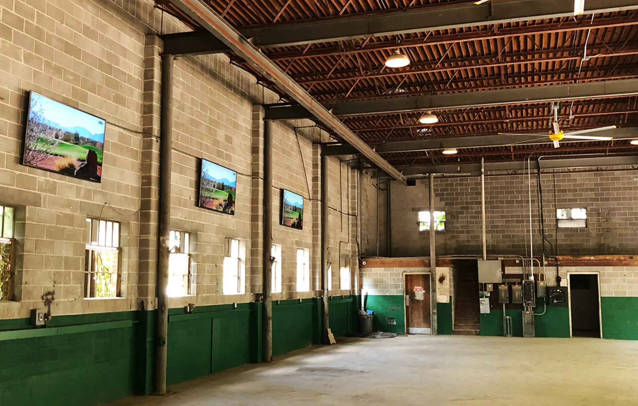 Industrial warehouse AV screen installation.
