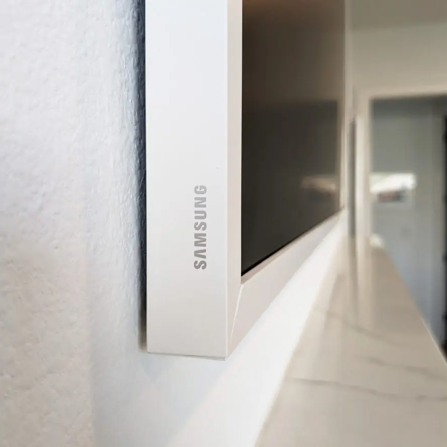 Samsung Frame TV edge with white frame.