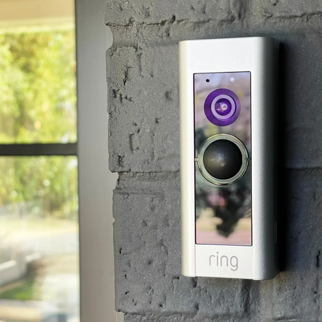 Ring doorbell installation next to front entry of home.