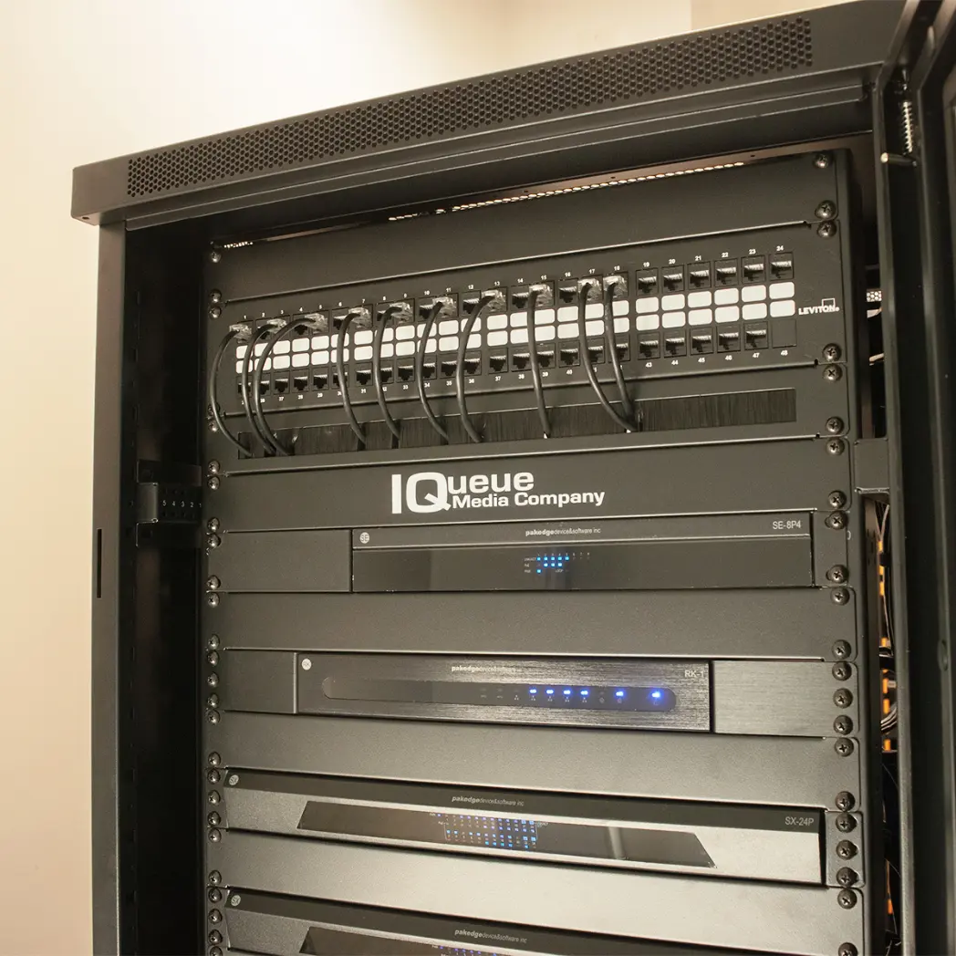 IQueue Media Company branded AV rack installation.