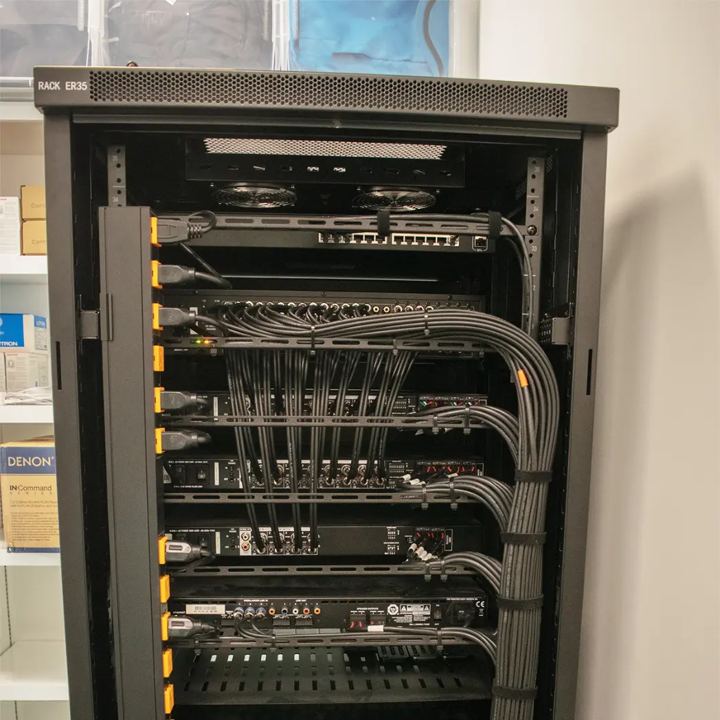 Cabling in back of AV rack installation.