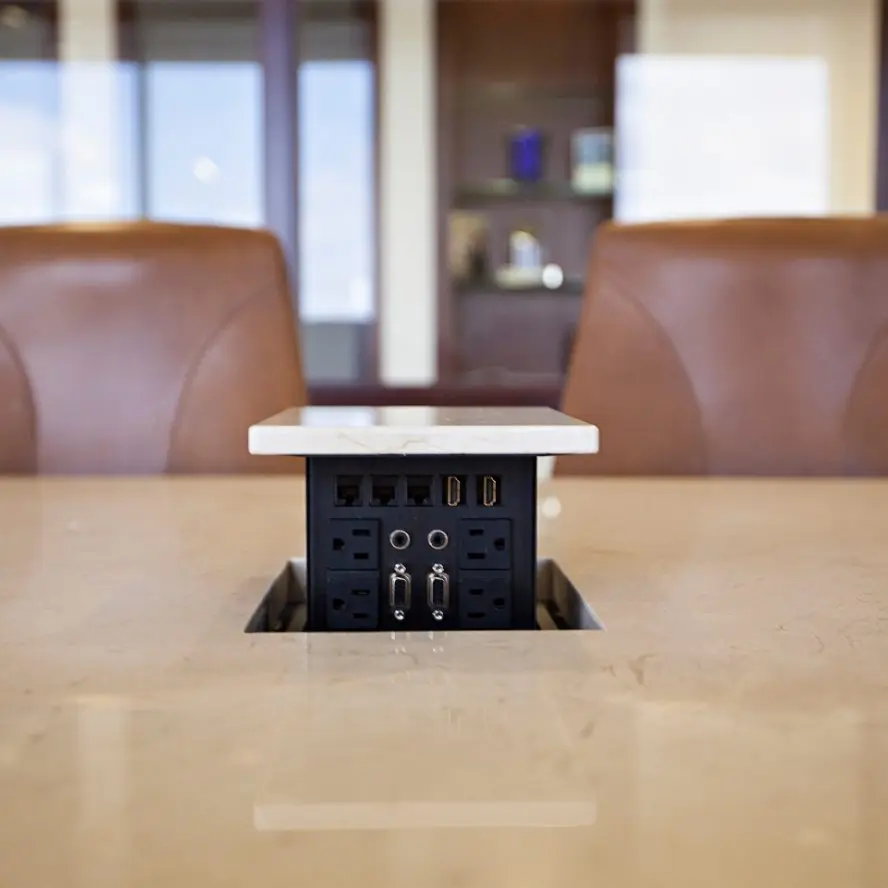 In-table electronics pop-up installation.