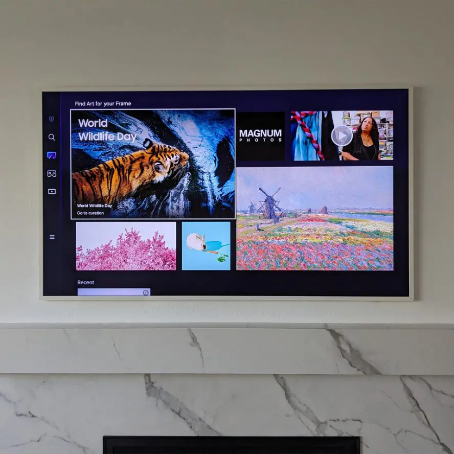 TV installation above marble fireplace. 
