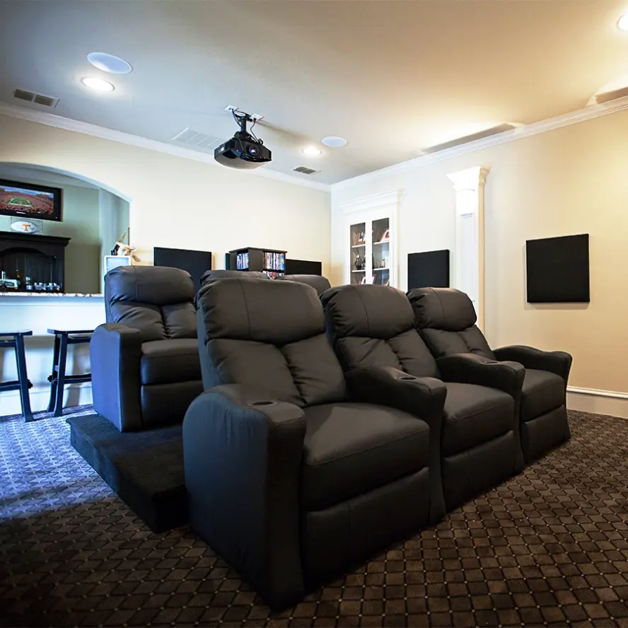 Home theater with projector and surround sound. 