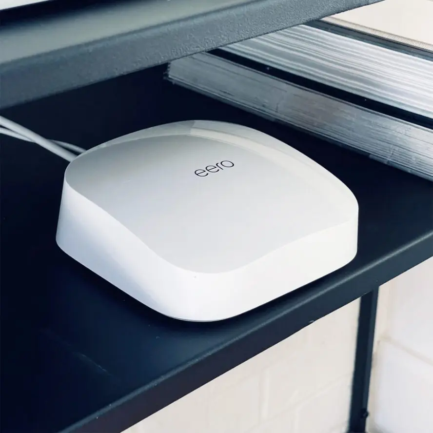 Eero WiFi extender installed in home.