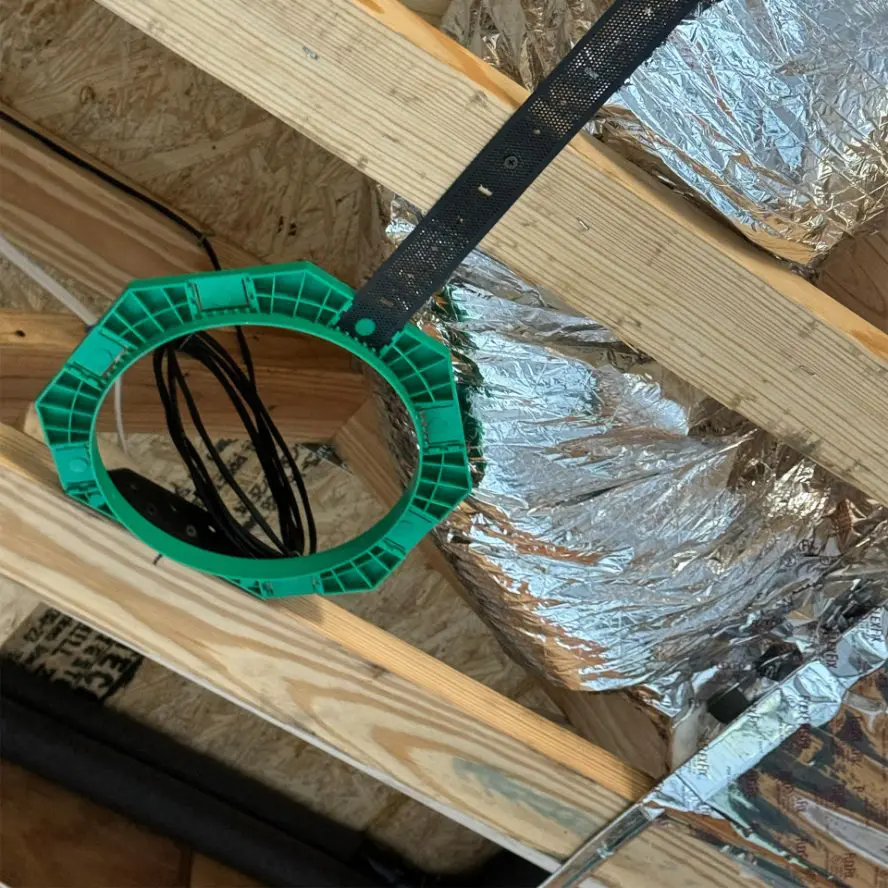 Electronics cabling installation in ceiling of new construction.