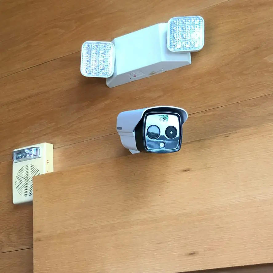 Office surveillance camera installed above entry.