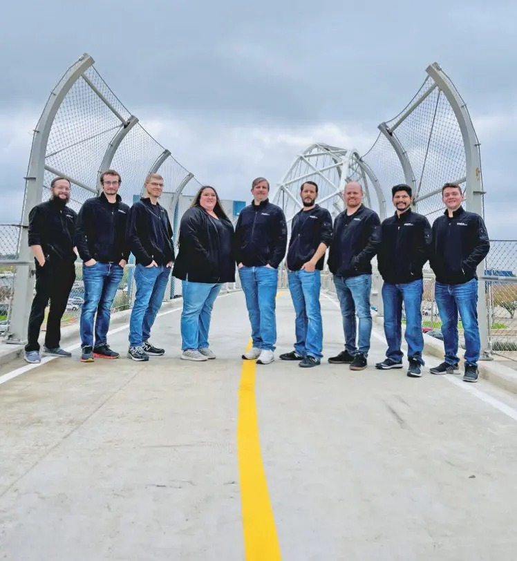 IQueue Media team members on bridge in Downtown Dallas.