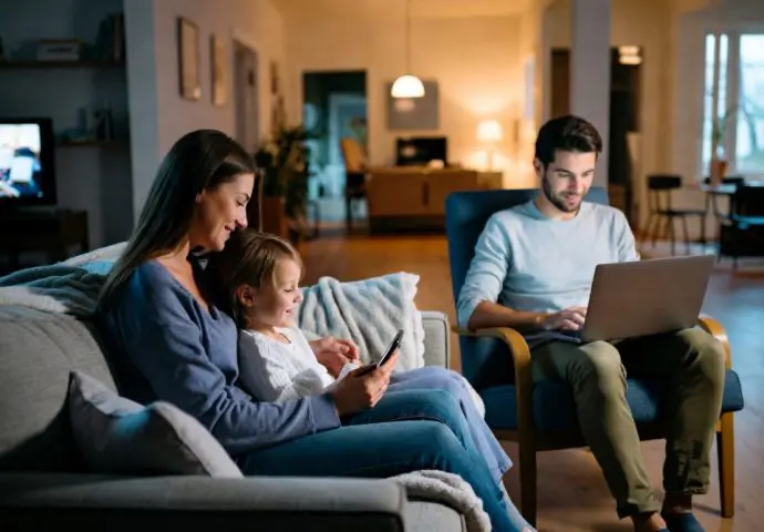 Connected home showing family enjoying their devices